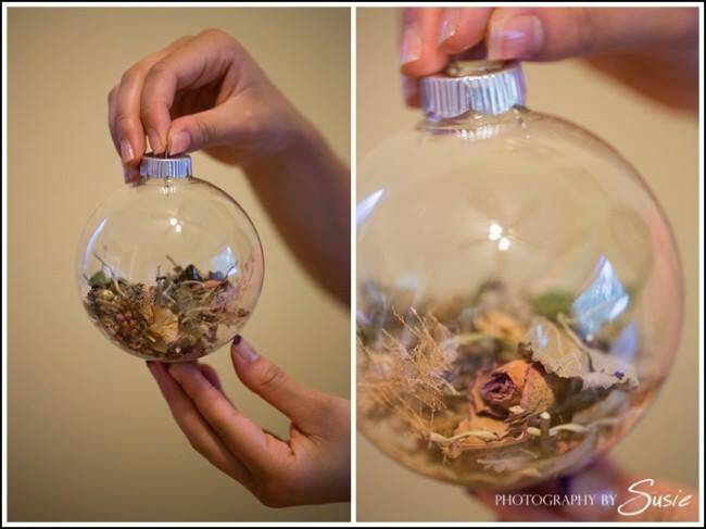 Dried flowers from bouquet put into globe type glass container for display