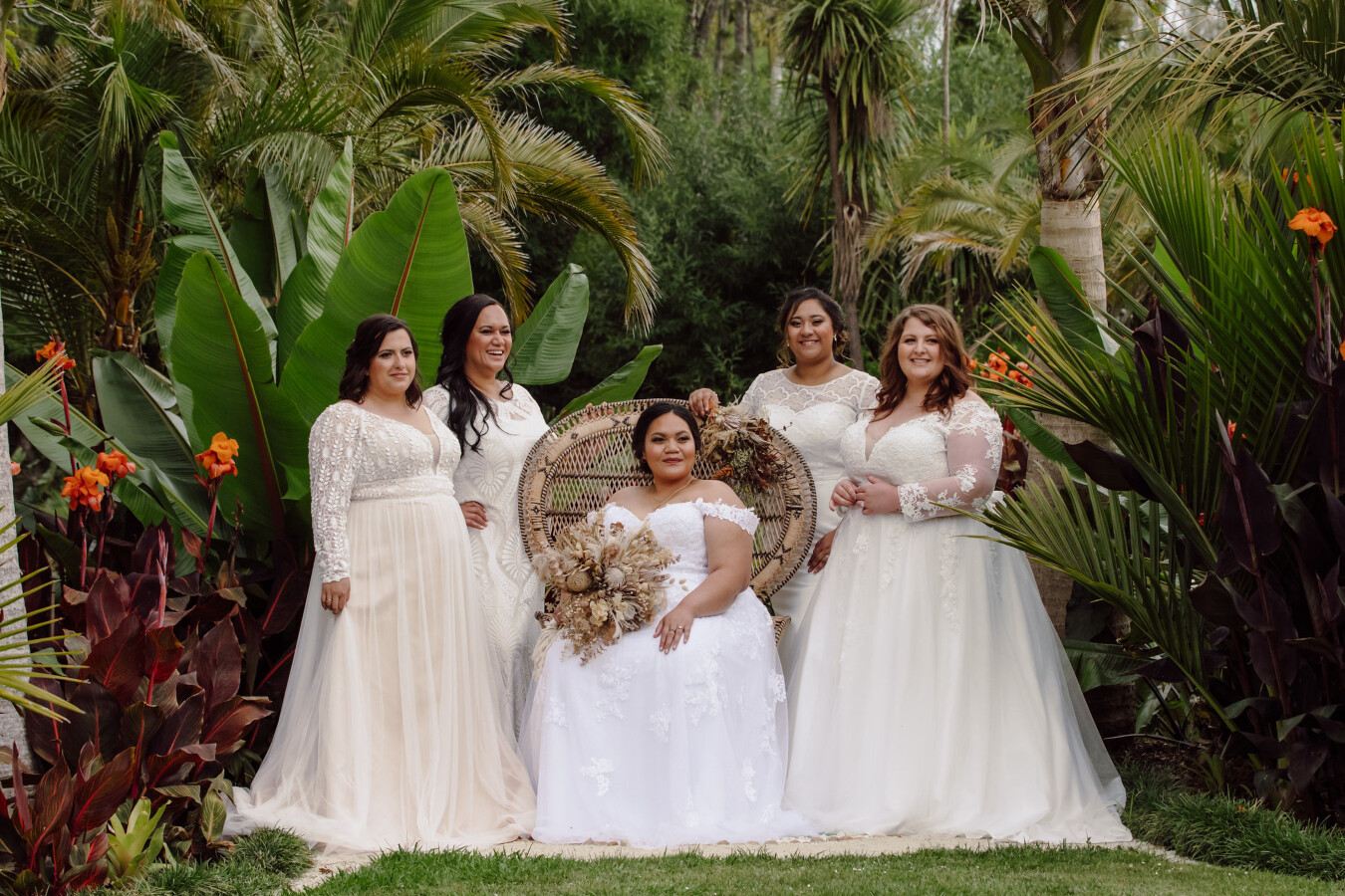 Project Curves - 5 plus size brides seated for group photo