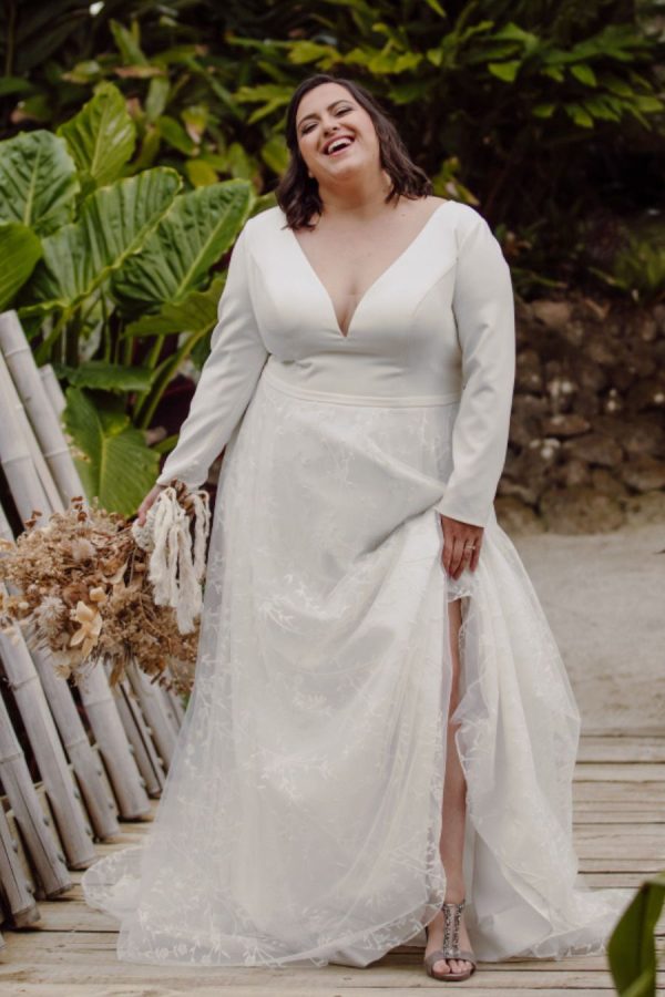 House Collection - Wedding gown Hera - A-line gown with low v-neck, crepe top lace skirt and long sleeves - fun shot.