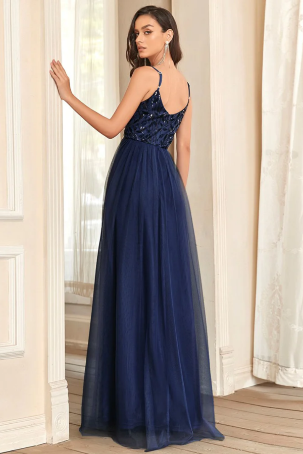 Ballgown style EE50090 Soft a-line gown with v-neck, shoestring straps with sequin bodice and net skirt.