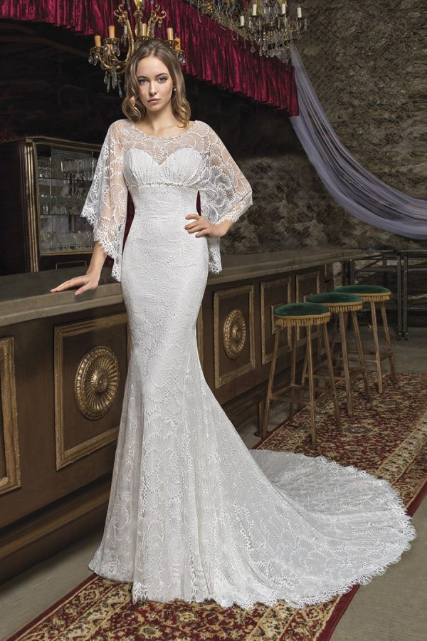 Wedding gown CM7973 - Trumpet silhouette gown with illusion neckline and open back. Made of an allover lace - Front view